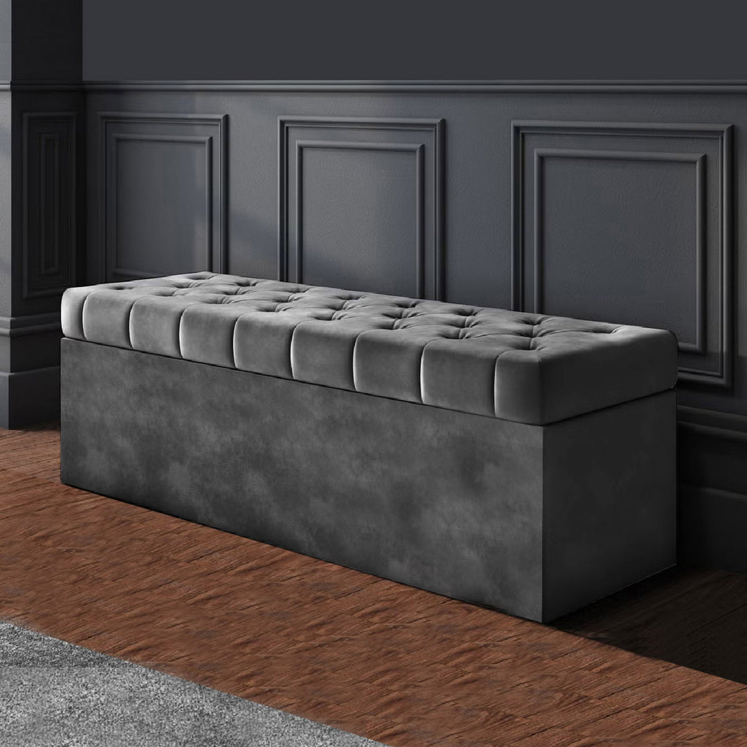 Dark Grey Chesterfield upholstered ottoman storage box in plush velvet with matching fabric buttons. Upholstered ottoman storage box or a velvet blanket box, Chesterfield velvet ottoman, Plush velvet storage ottoman, Upholstered ottoman storage box, Velvet storage bench ottoman, Tufted ottoman with storage, High-density foam lid ottoman, Velvet tufted storage bench, Deep storage ottoman velvet, Velvet upholstered bench with storage, Chesterfield storage bench, Ottoman with high-density foam lid, Velvet otto
